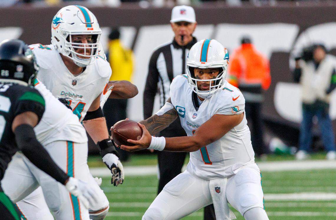 Miami Dolphins quarterback Tua Tagovailoa (1) lin action during second quarter of an NFL football game against the New York Jets at MetLife Stadium on Friday, Nov. 24, 2023 in East Rutherford, New Jersey.