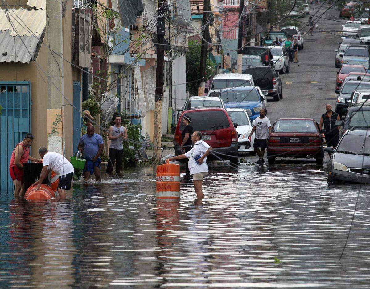 Maria touched every corner of Puerto Rico and left many areas, including San Juan, flooded and littered with debris that blocked roads.