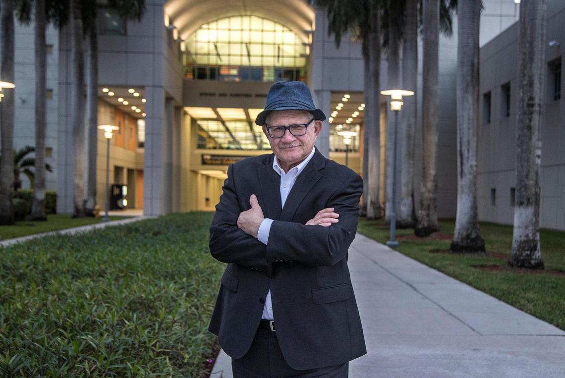 Mark Rosenberg, president of Florida International University, stands in front of the Steven and Dorothea Green Library at the FIU Modesto Maidique Campus in Miami, on Tuesday, Dec. 14, 2021. On Friday, FIU announced that Rosenberg had abruptly resigned.