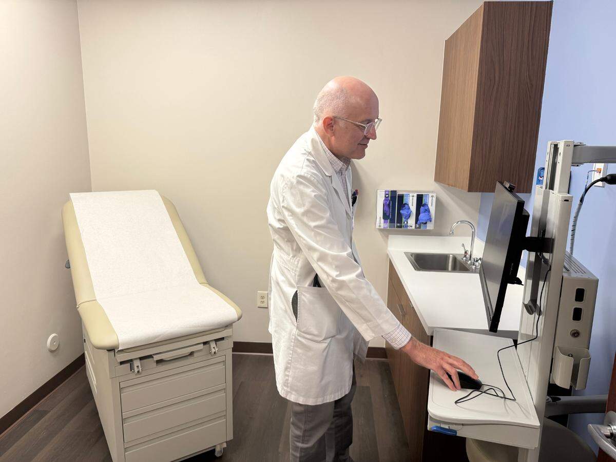 Dr. Jose Luis Velazquez-Cecena, cardiology associate medical director for Jackson Medical Group, poses for a photo inside the new exam rooms at Jackson South that are part of an expansion to offer more cardiac care services.