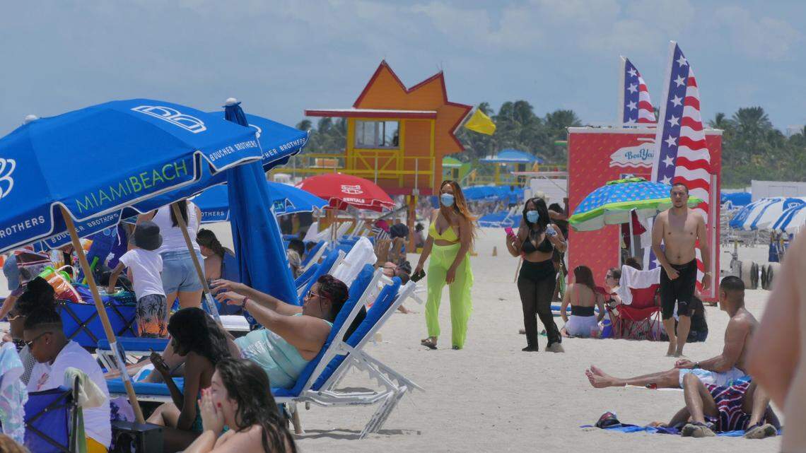 June 13 was the first weekend day that people could enjoy the beaches since they were closed due to the COVID-19 precautions. Here, people on South Beach near the 10th Street lifeguard stand wear masks.