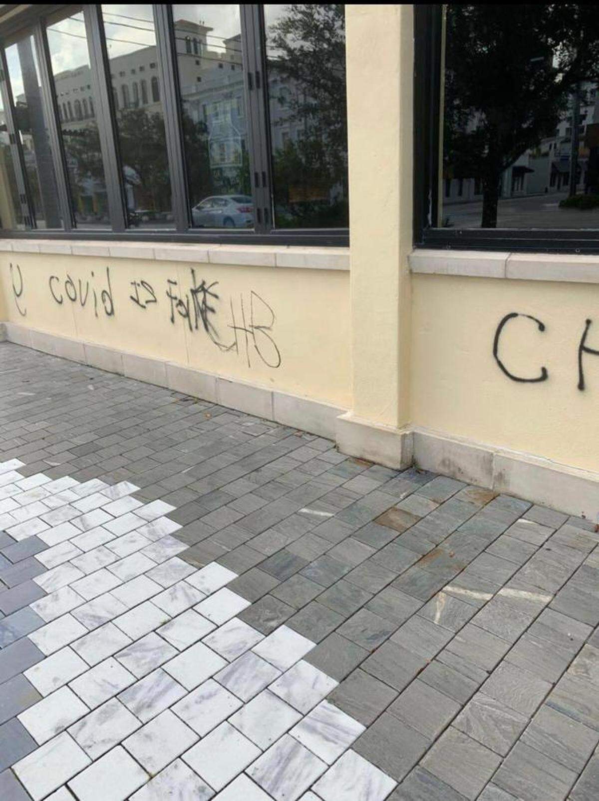 Several locations in Coral Gables, from Miracle Mile to the Coral Gables Youth Center, were vandalized with graffiti on Saturday, Aug. 22, 2020, according to police and The Gables Insider. This tag, reading “covid is fake” was found on storefronts along the Mile.