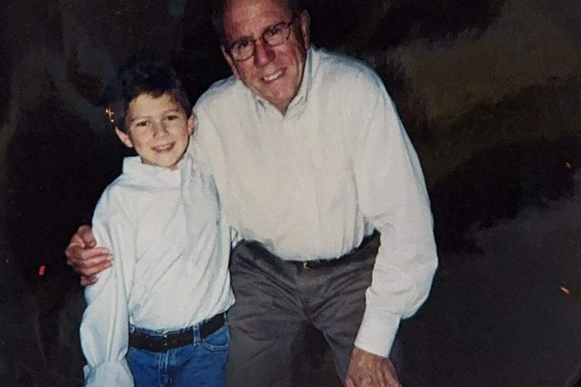 A young Jake Burger with his grandfather, Terry Cook.