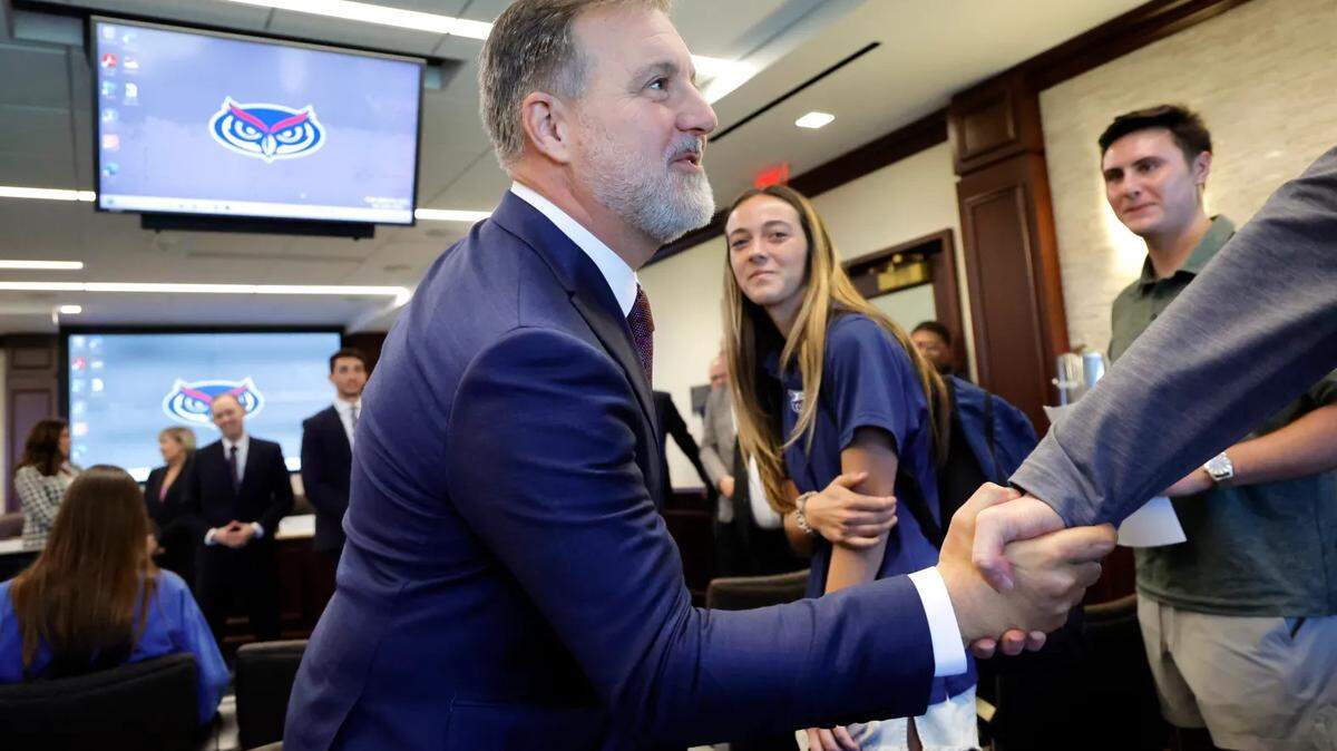Former Florida State Rep. Adam Hasner shakes hands with students after being announced as FAU’s next president on Monday, Feb. 10, 2025.