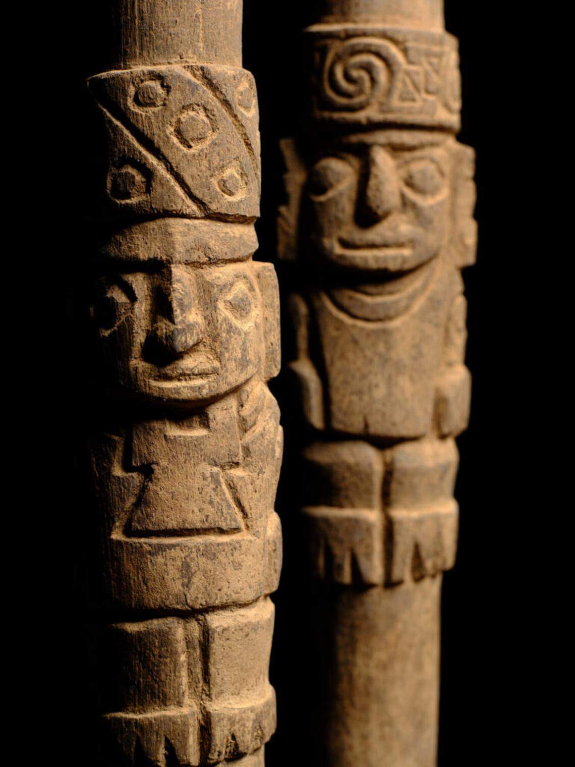 The team also found two wooden staffs with carved depictions of deities.