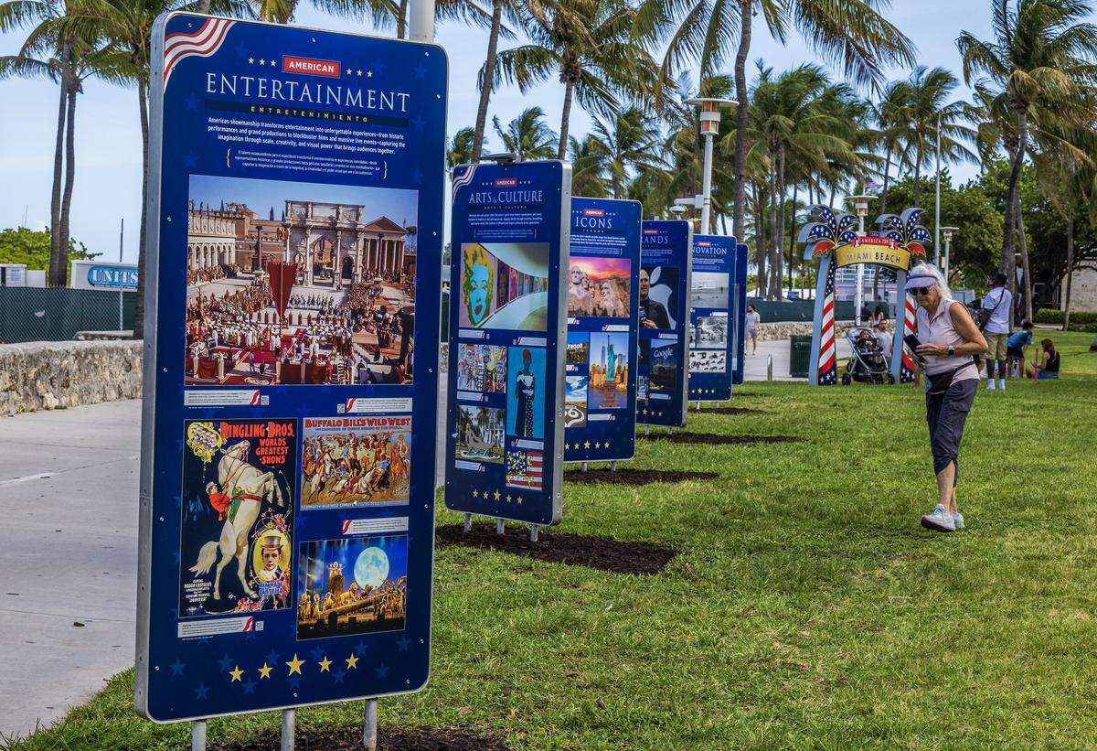 Attendees checks the different images on display during the unveiling “ceremony of the Miami Beach FREEDOM" outdoor exhibition on Thursday May 21 at Galería Ocean Drive in Lummus Park (between 11th and 12th Streets) to commemorate America's 250th anniversary. The exhibit features 34 weatherproof panels honoring American icons and runs through July 15, 2026.