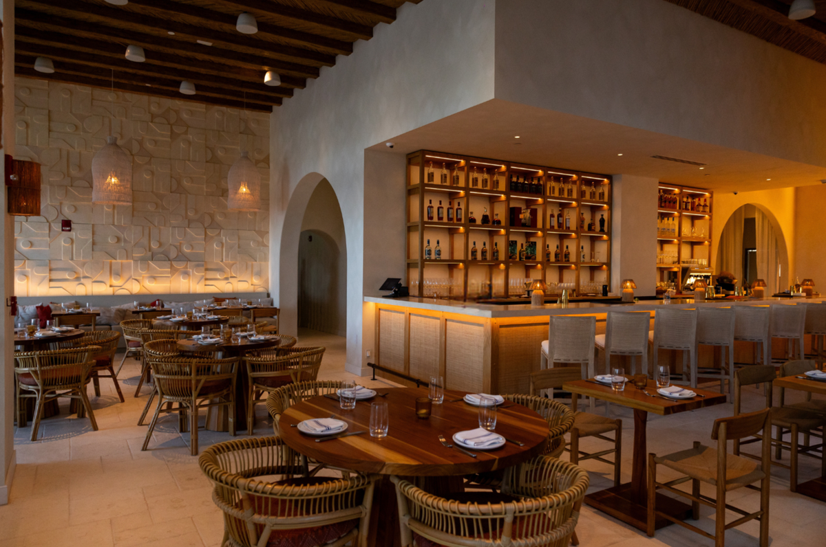 The glow of evening inside Yaya Coastal Cuisine restaurant, now open on the bay in Miami. The restaurant was designed by the local Saladino Design Studios.