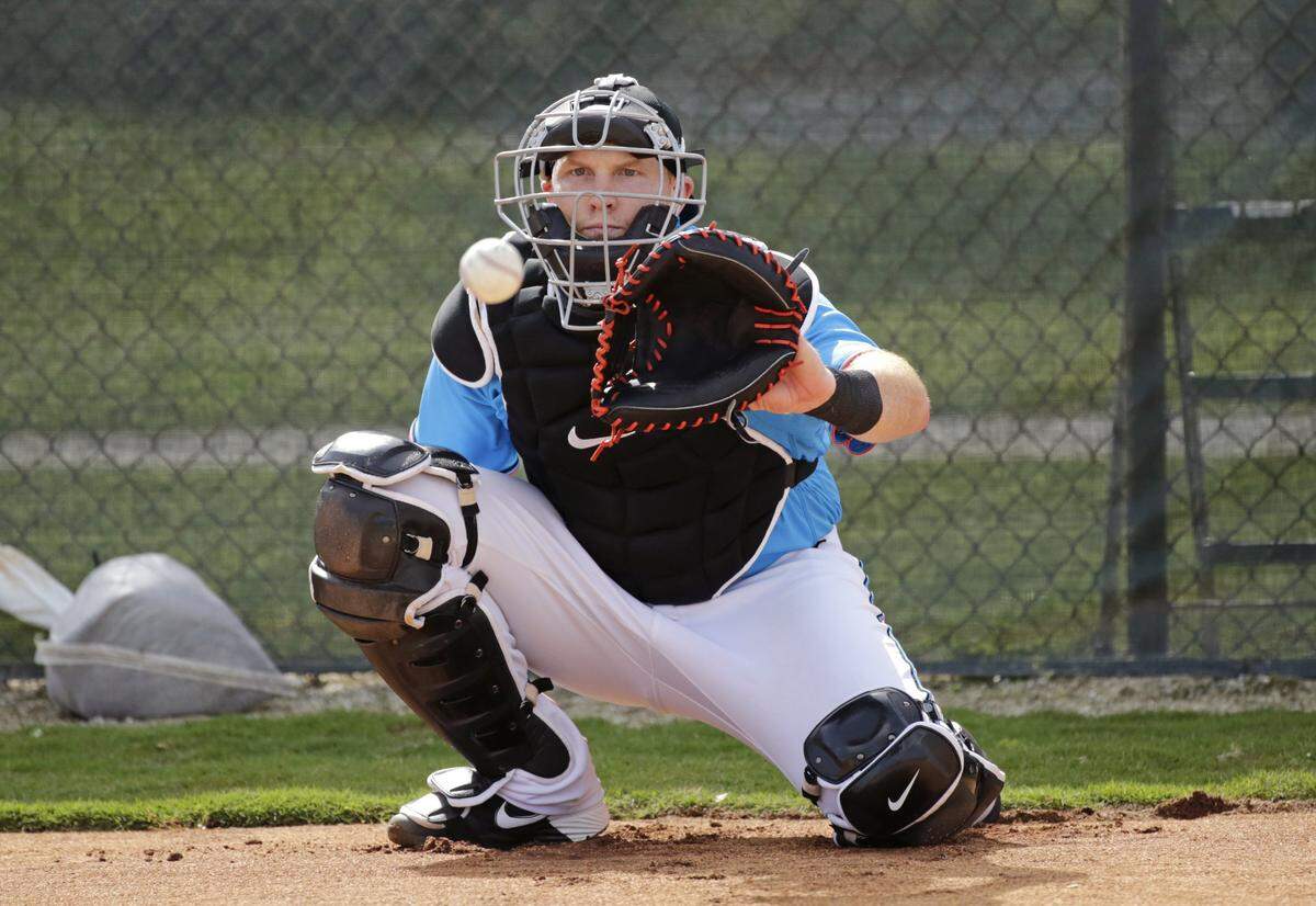 Miami Marlins catcher Chad Wallach eyes on the baseball during the spring training baseball workouts for pitchers and catchers at Roger Dean Stadium on Wednesday, February 12, 2020 in Jupiter, FL.