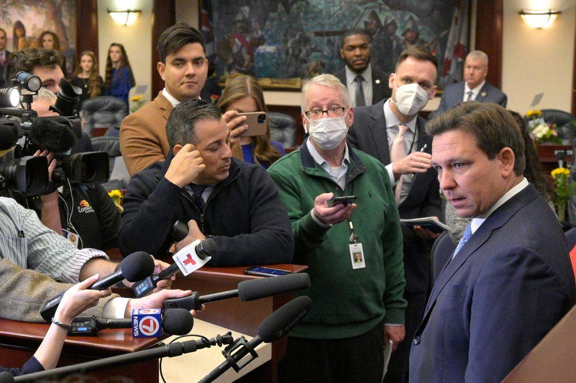 Florida Gov. Ron DeSantis, right, answers questions from reporters after addressing a joint session of the Legislature, Tuesday, Jan. 11, 2022, in Tallahassee, Fla.