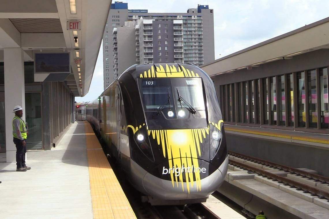 A Brightline train — now Virgin Trains USA — arrives at the MiamiCentral station in downtown Miami. Service has been suspended until further notice.