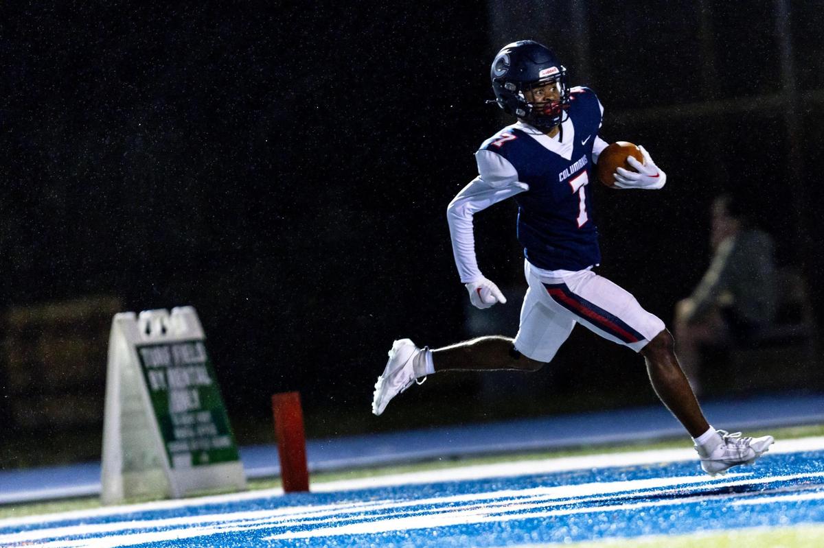 Columbus cornerback Jancent Wallace (7) completes the ‘scoop and score’ for a touchdown during the second quarter of an FHSAA football playoff game against the Western wildcats at Tropical Park in Miami, Florida, on Friday, November 24, 2023.