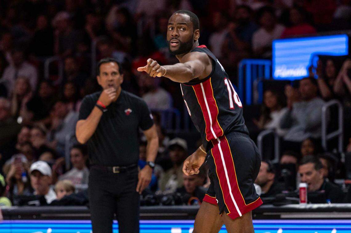 Miami Heat guard Alec Burks (18) points to a player while gets back on defense during the second half of an NBA game against the Charlotte Hornets at Kaseya Center on March 23, 2025, in Miami.