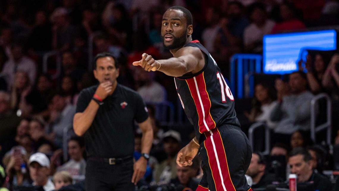 Miami Heat guard Alec Burks (18) points to a player while gets back on defense during the second half of an NBA game against the Charlotte Hornets at Kaseya Center on March 23, 2025, in Miami.