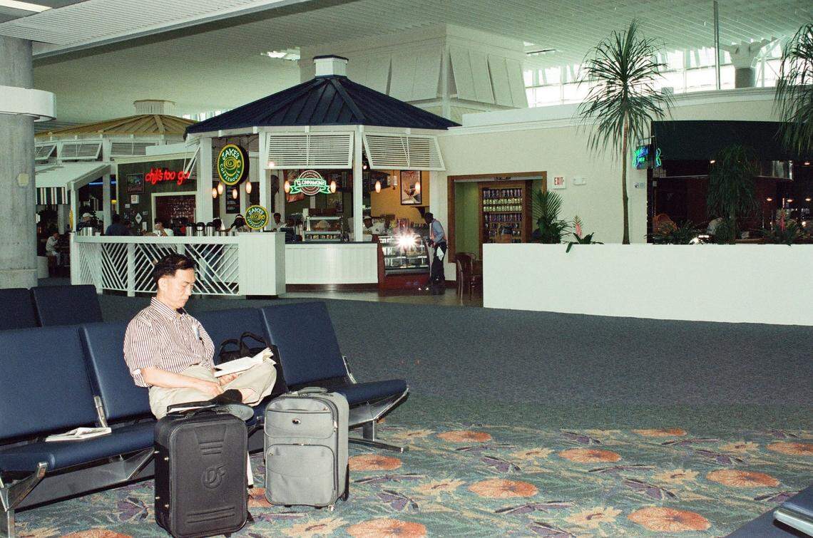 Travelers walk through the Fort Lauderdale International Airport terminal in 2001.