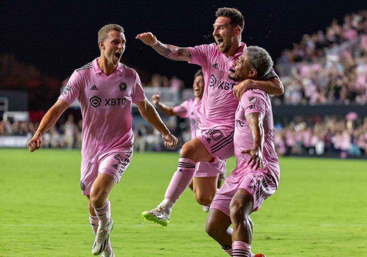 Inter Miami forward Lionel Messi (10) celebrates with teammates defender DeAndre Yedlin (2) and defender Christopher McVey (4) after scoring the go ahead goal during the second half of a Leagues Cup group stage match against Cruz Azul Stadium on Friday, July 21, 2023, in Fort Lauderdale, Fla.