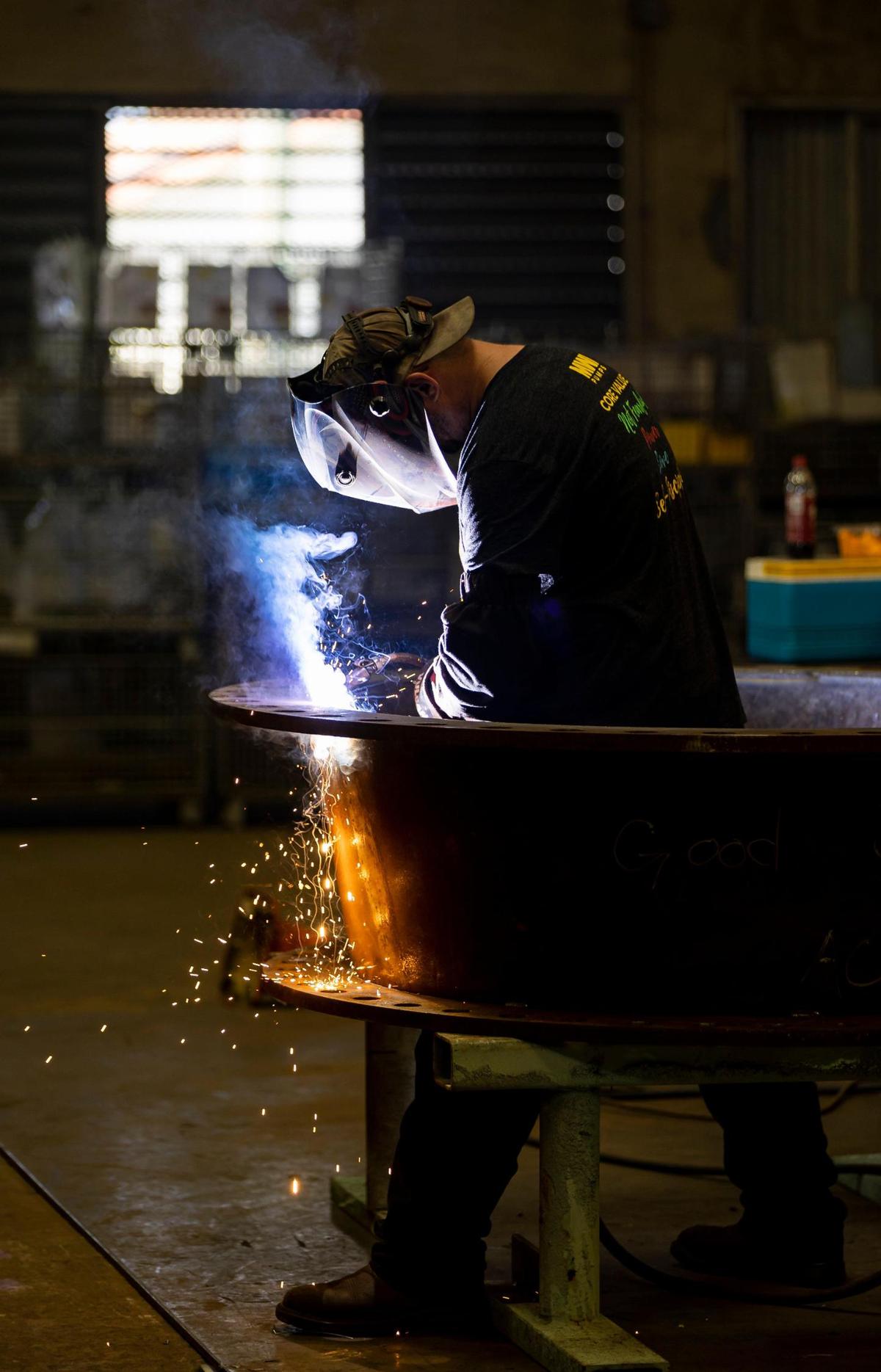 Eric Watson, a welder fabricator, is seen working at MWI Pumps on Wednesday, Nov. 2, 2022, in Deerfield Beach, Fla.
