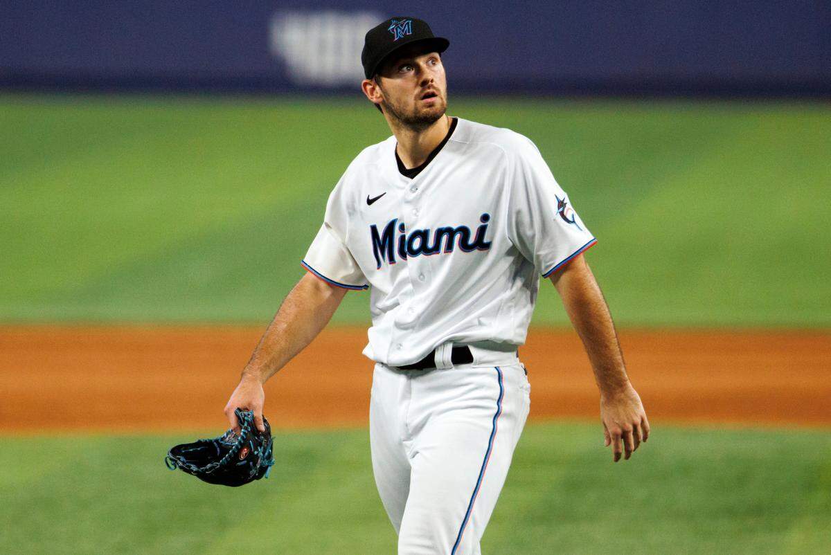 Miami Marlins relief pitcher Zach Pop (56) walks to the dugout after finishing the ninth inning of a baseball game against the New York Mets at LoanDepot Park on Sunday, July 31, 2022 in Miami, Florida.