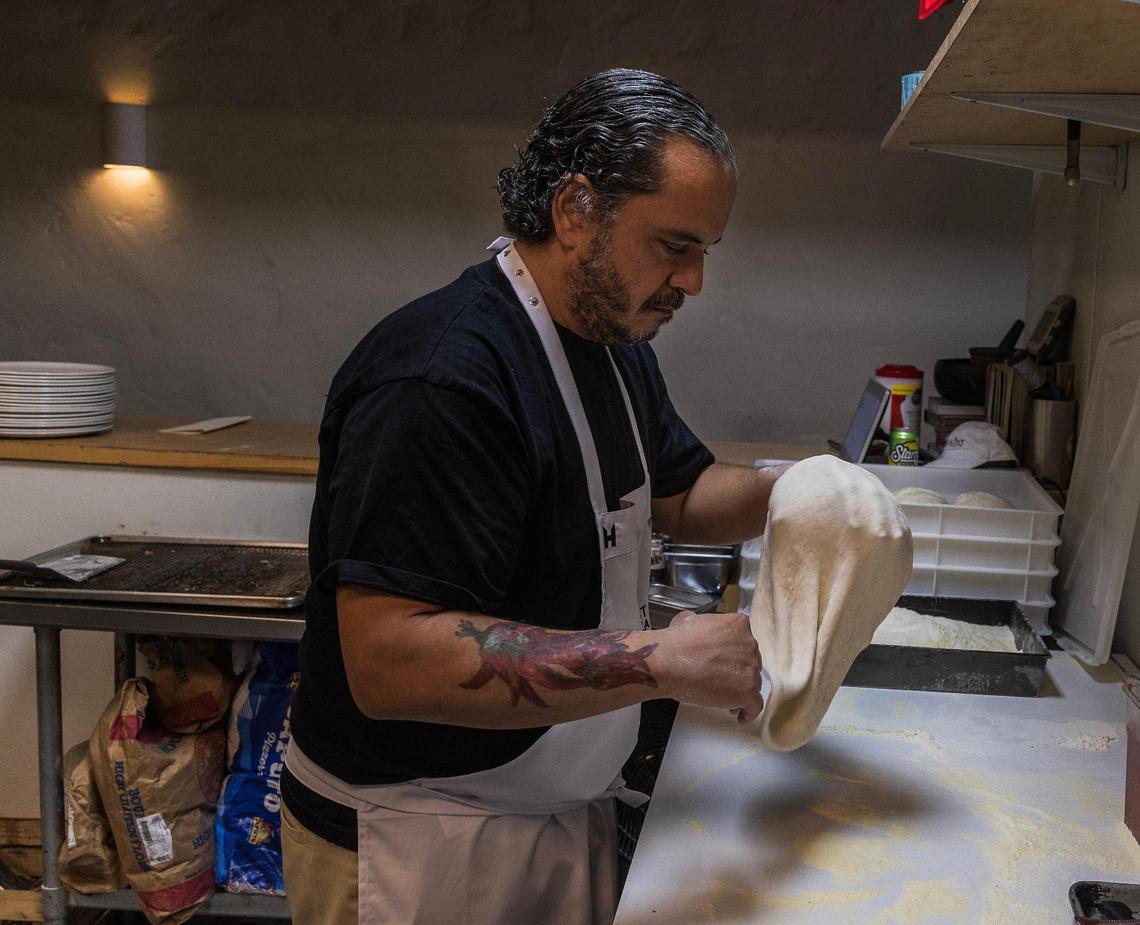 Chef Javier Ramirez prepares dough for a pizza at La Natural in Little River. The secret to the crust? Sourdough.
