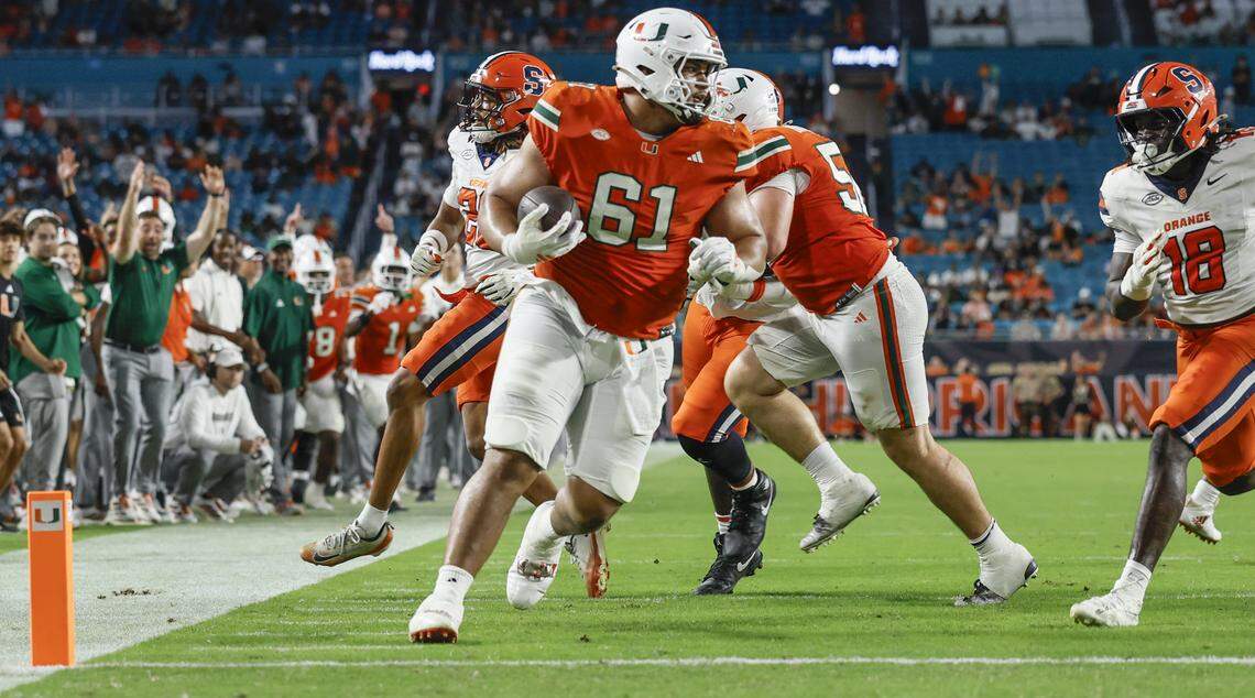 Miami Hurricanes offensive lineman Francis Mauigoa (61) scores in the second half of an NCAA football game against the Syracuse Orange at Hard Rock Stadium in Miami Gardens, Florida on Saturday, November 8, 2025.