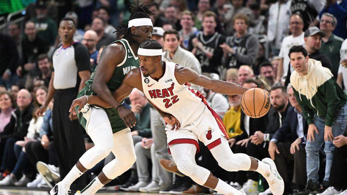 Miami Heat forward Jimmy Butler drives against Milwaukee Bucks guard Jrue Holiday during Game 5 of the 2023 NBA Playoffs at Fiserv Forum.