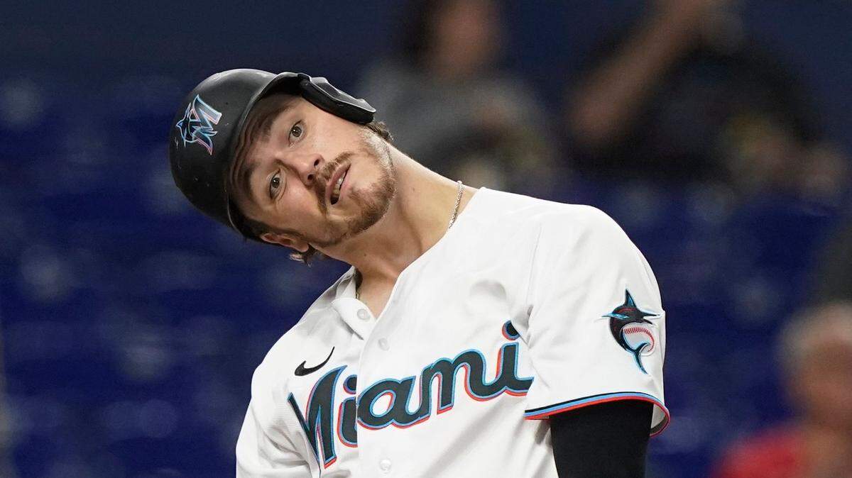 Miami Marlins’ Brian Anderson tilts his head as he follows his foul ball in the third inning of a baseball game against the Los Angeles Dodgers, Monday, Aug. 29, 2022, in Miami. (AP Photo/Marta Lavandier)