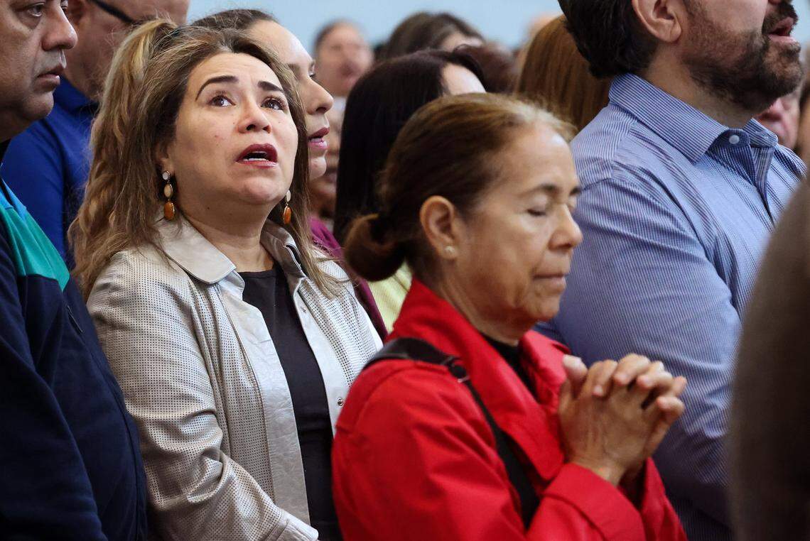 Members of the Venezuelan exile community gather in prayer during the 10 a.m. Sunday Mass led by Reverend Israel Mago, one day after the United States attacked Venezuela and captured Venezuelan leader Nicolás Maduro and his wife, Cilia Flores, on Sunday, January 4, 2026, in Doral, Florida. 