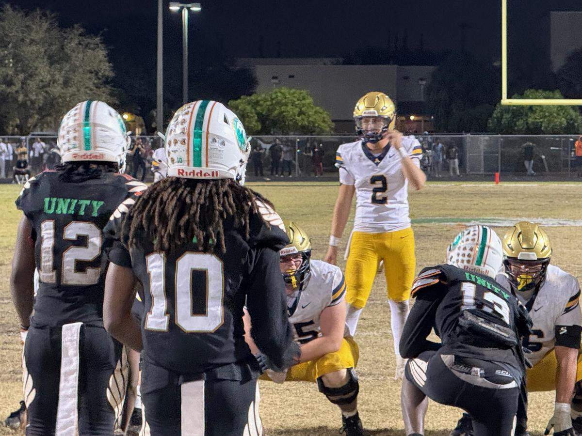St. Thomas Aquinas senior quarterback Andrew Indorf looks over the line of scrimmage during the first overtime of Friday’s Region 4-5A final against Delray Beach Atlantic.