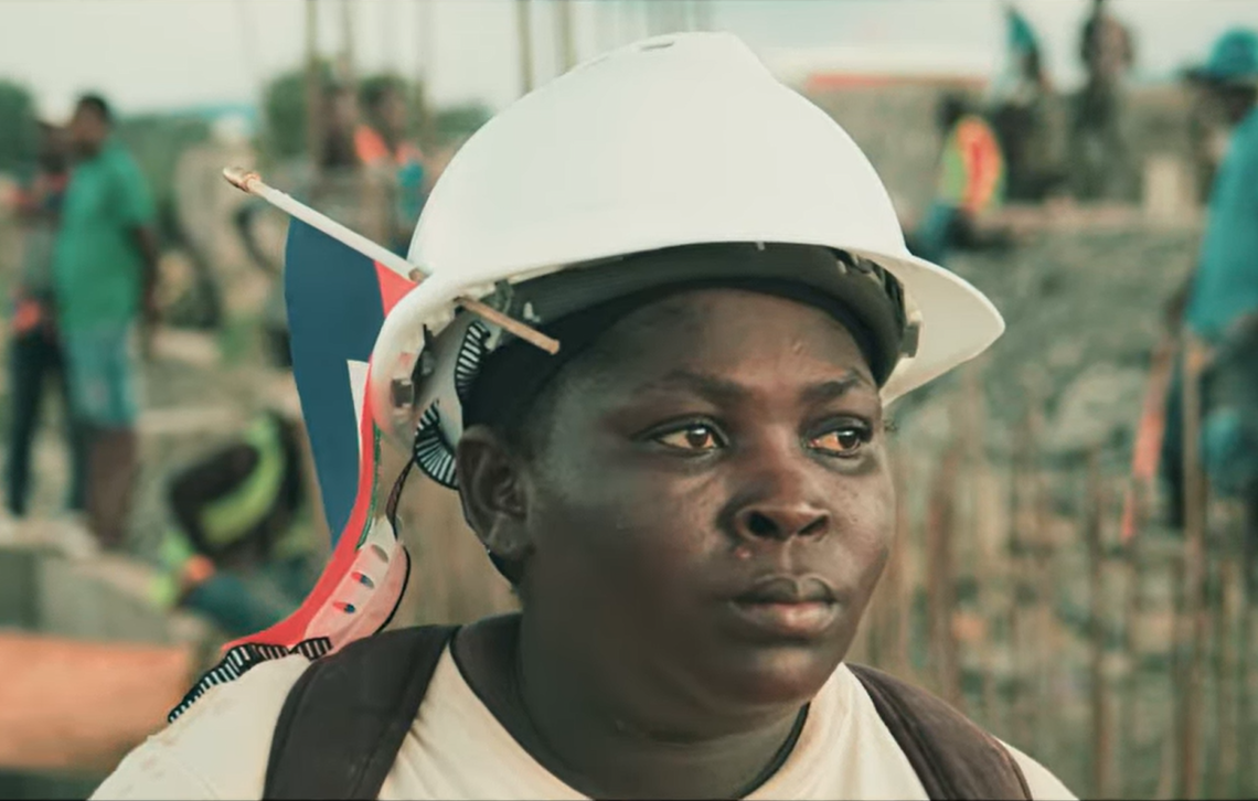 A still shot from the trailer of the documentary ‘The Heroes of the Massacre River’ shows Milourie Sylfrard, an advocate for the canal and mason who lent her skills to its construction. Sylfrad died in October 2024 and was essential in the building of the canal.