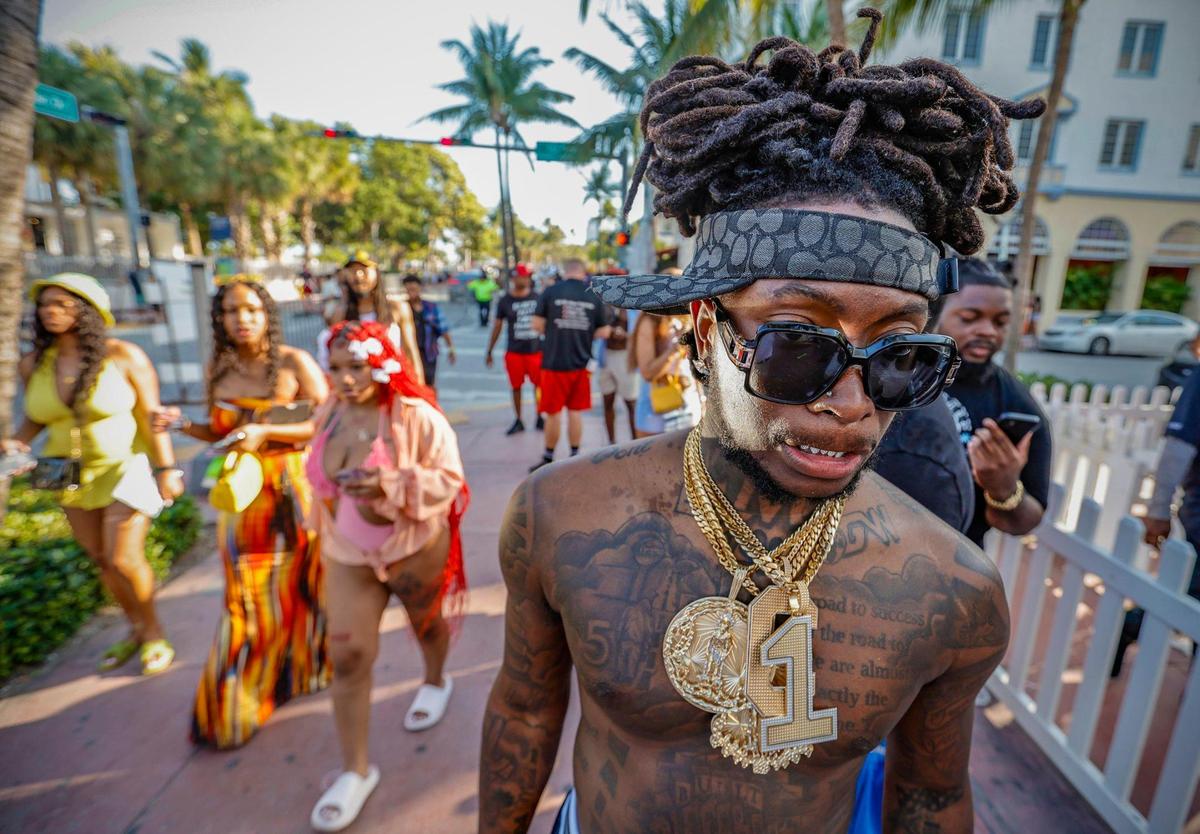 Claude Leger, 24, of Tallahassee, stands across from the Clevelander Hotel on Ocean Drive and 10th Street during spring break on Miami Beach, Florida on Sunday, March 17, 2024.