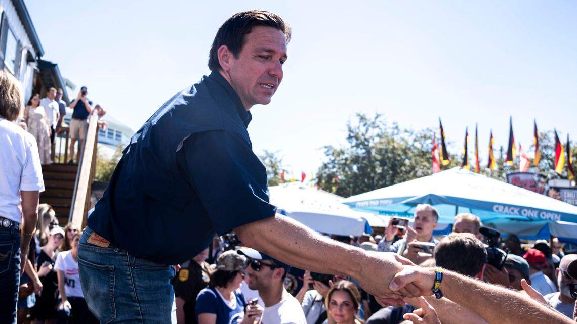 GOP presidential candidate Ron DeSantis shakes hands with supporters during at the Iowa State Fair on Aug. 12 in Des Moines.