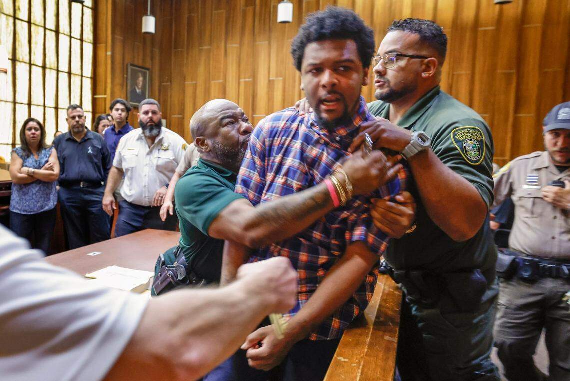 Adrian Cosby has to be restrained in a Miami-Dade courtroom late Friday, Oct. 25, 2024, after he was found guilty of murdering Andrea Camps-Lacayo, an 18-year-old student at Terra Environmental Research Institute in West Kendall. She was killed in 2020 in a botched robbery of expensive sneakers. Cosby leapt at Andrea’s father while he was reading a statement in court.