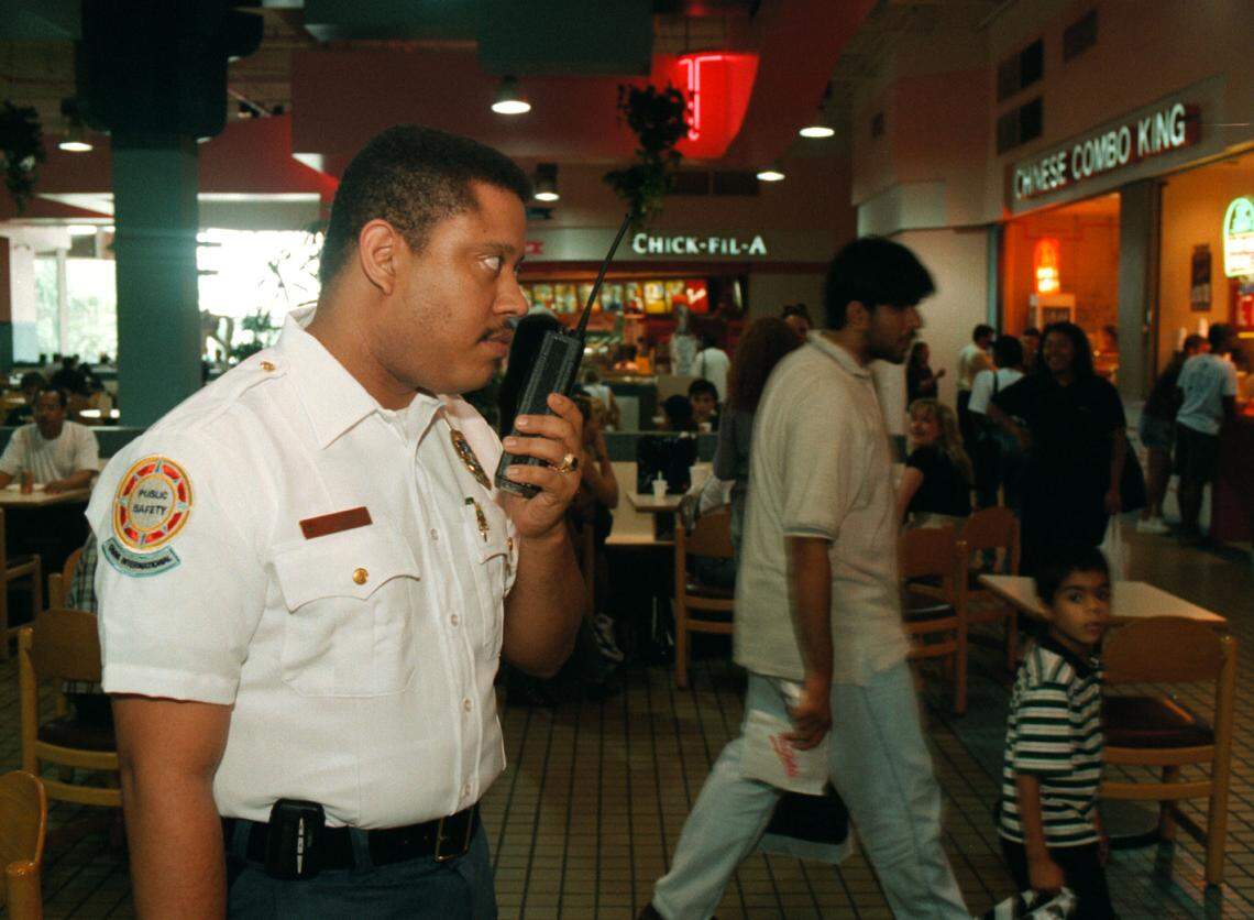 Juan Lopez patrols the food court area of the Omni mall.