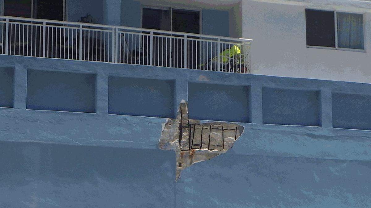 A Miami Beach building inspector photographed this section of spalled concrete on the exterior of the Port Royale Condo, at 6969 Collins Ave., before giving the building an unsafe structure violation.