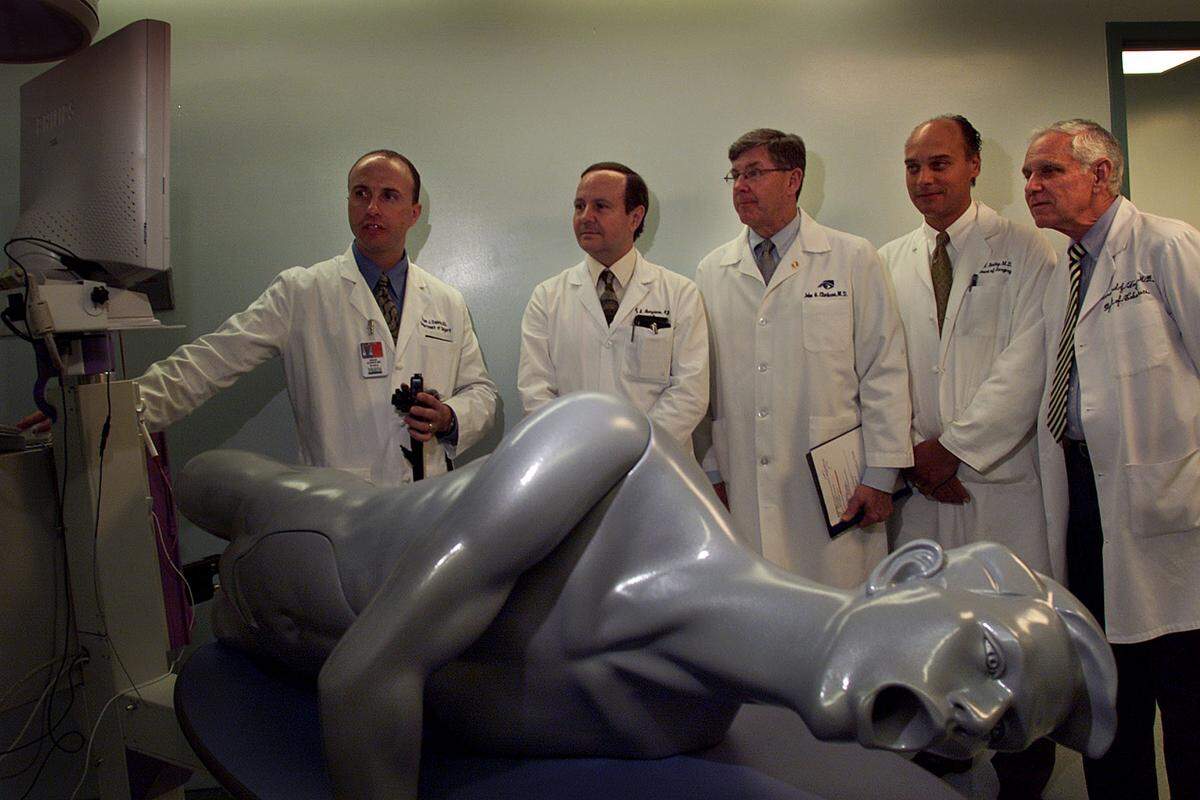 In this May 30, 2001 file photo University of Miami doctors get a demonstration of a simulator using a flexible endoscope for colonoscopy and other gastrointestinal diagnosis. The doctors left to right are: Brian J. Dunkin; Alan S. Livingstone, UM Medical School Dean John Clarkson, center; Director Robert W. Bailey; and Dean Emeritus Bernard Fogel at the UM Medical School during opening of the new Center of Excellence for Laparoscopic and Minimally Invasive Surgery at the UM School of Medicine.