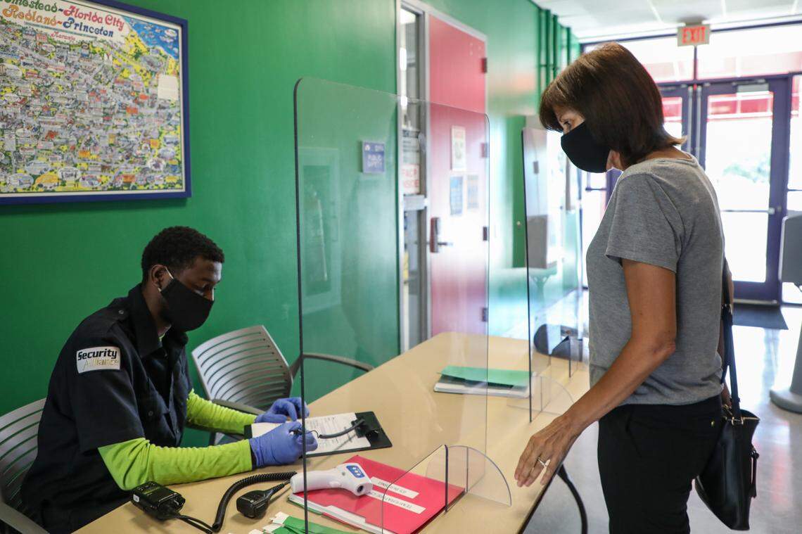 Miami Dade College students and staff get the temperature checked when they arrive to the Homestead campus check point on June 17, 2020.