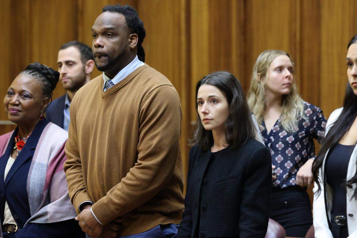 Rashaun Jones, who is accused of killing his University of Miami football teammate Bryan Pata in 2006, sits with defense attorneys in Judge Cristina Miranda Courtroom 4-1 at the Richard E. Gerstein Justice Building in Miami, FL, on Monday, March 2, 2026.