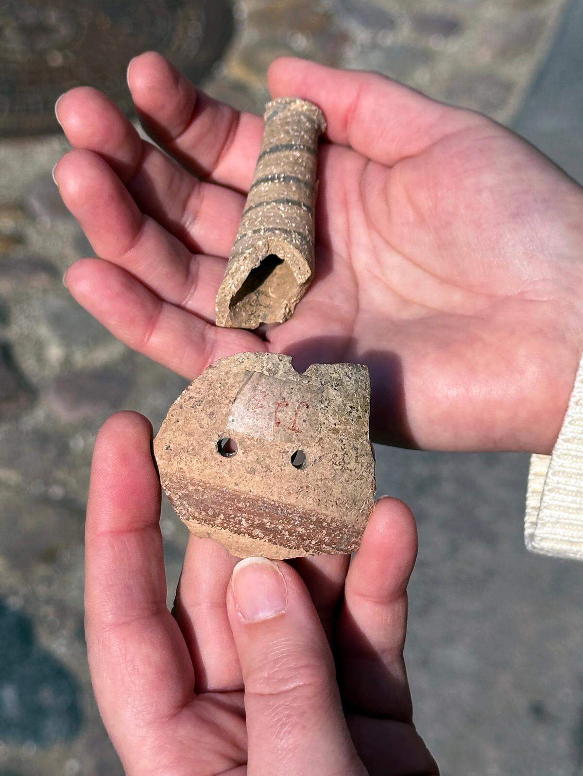Clay pieces that made up the handle and the orb of the rattles were found in excavations from nearly a century ago.