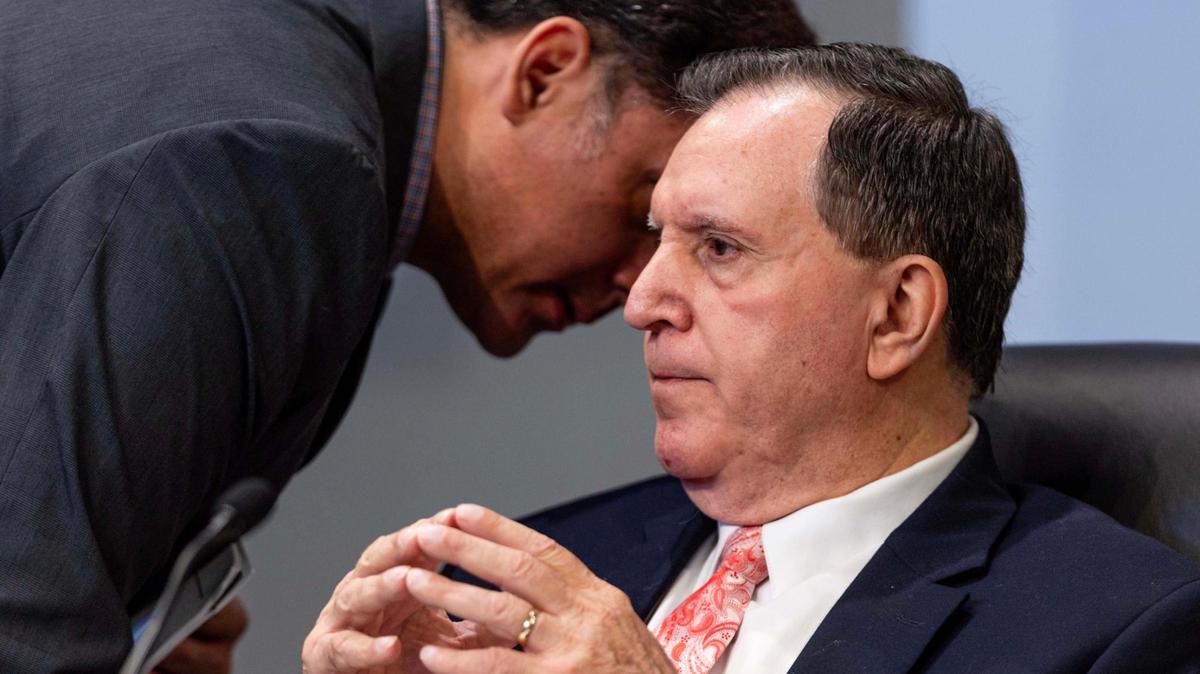 Commissioner Joe Carollo listens to an aide during a Miami City Commission meeting on Tuesday, June 17, 2025.