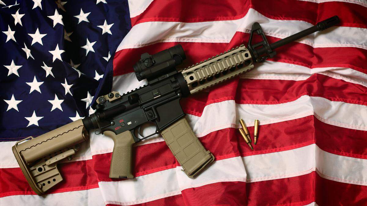 An AR-15 rifle with bullets on an American flag. “I received several emails and texts from readers who voiced their opinions about the hate that seems to be destroying our country. Here are a few.”