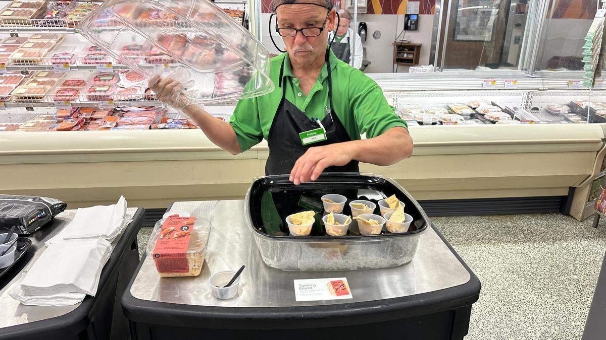 Staff at a Kendall Publix preps the patties and dip for a tasting on Saturday, Sept. 13.