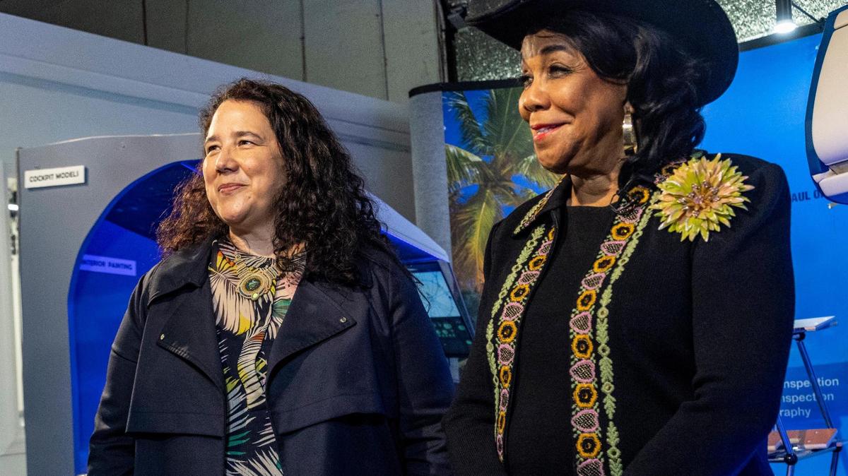 SBA Administrator Isabella Guzman, left, and U.S. Rep. Frederica Wilson of Miami stop to answer questions from reporters as they tour Aero Marine Interior in Miami Gardens on Monday, March 21, 2022.