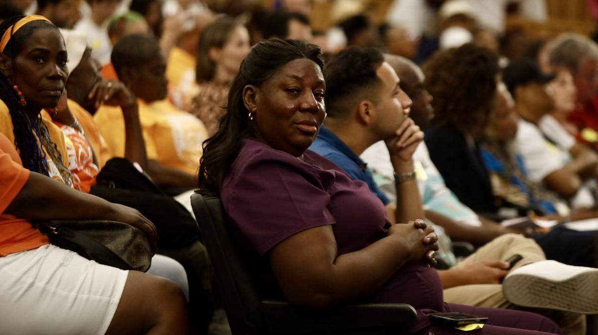 Housing advocate Trenise Bryant joins fellow supporters of Miami-Dade County’s eviction-prevention programs at the budget hearing on Sept. 5, 2024. 