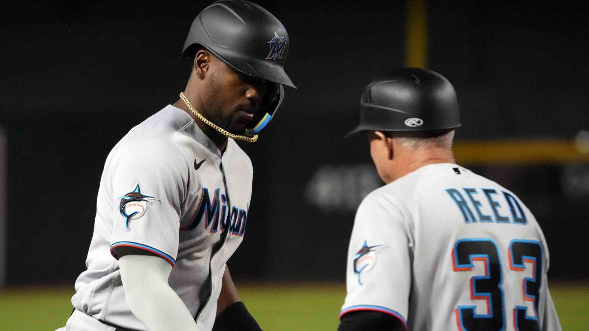 Miami Marlins designated hitter Jorge Soler (12) slaps hands with Miami Marlins third base/infield coach Jody Reed (33) after hitting a home run against the Arizona Diamondbacks during the fifth inning at Chase Field on Tuesday, May 9, 2023.