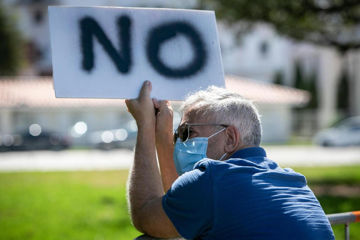 Manuel Fernandez attends a protest in front of Coral Gables City Hall on Tuesday, February 9. Residents and activists are protesting a vote over a change in the zoning code that would affect development on Miracle Mile.