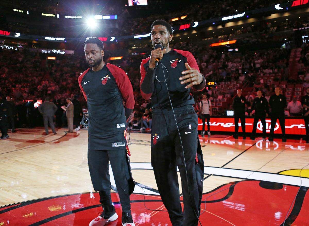Miami Heat’s Udonis Haslem, right, along with Dwyane Wade thank the fans before the start of the game against the Charlotte Hornets at AmericanAirlines Arena on Saturday, Oct. 20, 2018 in Miami.