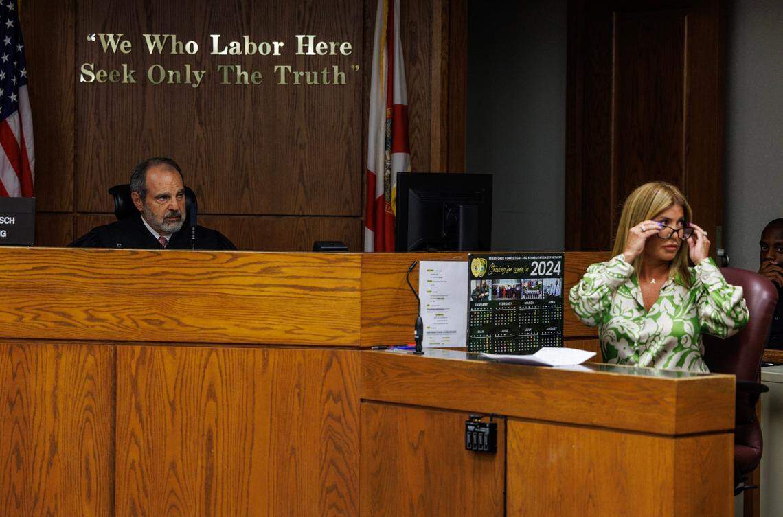 Miami-Dade Circuit Court Judge Milton Hirsch and Lissette Rey, the wife of Jose Rey, the man shot and killed by Omar Rodriguez, react as correction officers remove Rodriguez from the courtroom after his outburst, Thursday, Aug. 15, 2024.