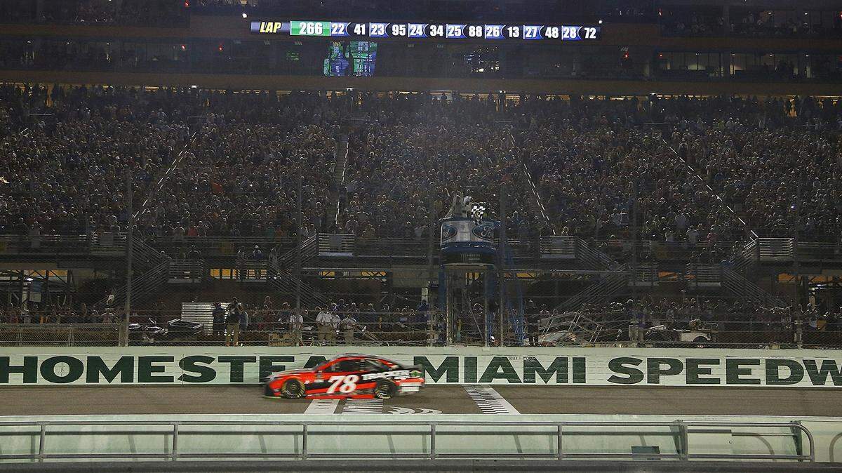 Martin Truex Jr., crosses the finishing line to win the EcoBoost 400 and the Monster Energy NASCAR Cup Series Championship.  On Sunday, November 19, 2017 NASCAR drivers competed in the Ford EcoBoost 400 in the final race of the Ford Championship Weekend.  