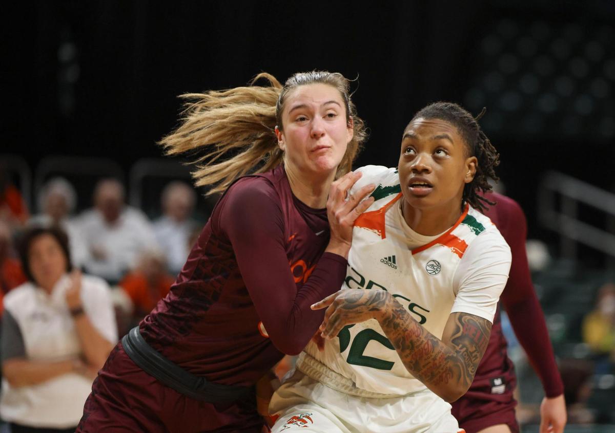 Virgina Tech’s Elizabeth Kitley (33) shoves Hurricane’s Lazaria Spearman (32) during the third quarter of the NCAA game between the University of Miami Hurricanes and Virginia Tech on Sunday, Jan. 8, 2023, at Watsco Center in Coral Gables. The Hurricanes won 77-66.