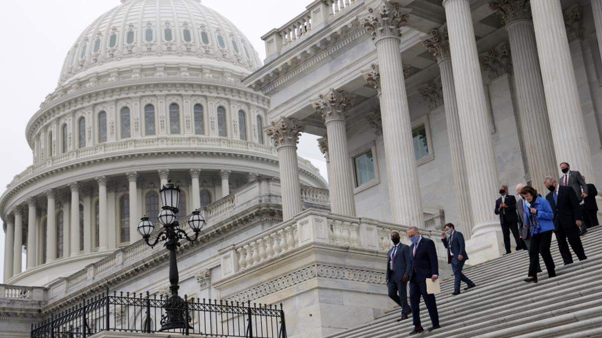 Democratic members of U.S. Senate Judiciary Committee, led by Senate Minority Leader Sen. Chuck Schumer, walk down the east front steps of the U.S. Capitol.