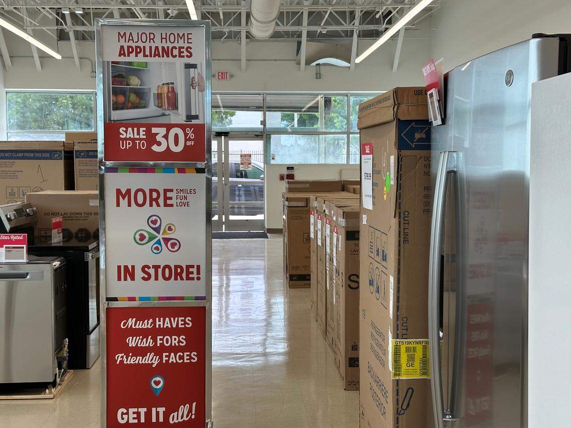 “Must Haves. Wish Fors. Friendly Faces. Get it all!,” a red sign display tower beckons near the large appliances section of the Kmart store in the Kendale Lakes Plaza shopping center on Aug. 23, 2024.
